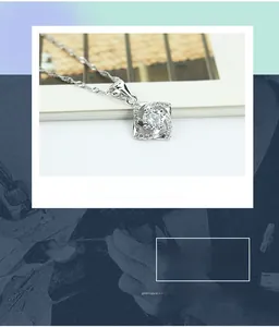 Macro shot of silver clover pendant with central zircon and pavé diamonds inlay