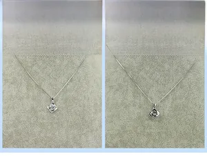 Detailed front and back view of a silver S925 flower pendant with micro-inlaid zircon