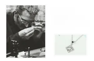 Detailed view of silver four-leaf clover pendant with sparkling cubic zirconia inlay
