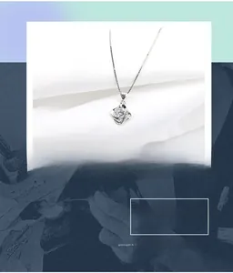 Detailed view of S925 silver necklace with micro-pave swirl pendant and large round zircon