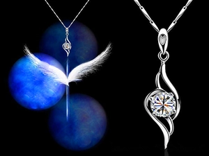Macro detail of S925 sterling silver angel wing pendant with sparkling round cubic zirconia