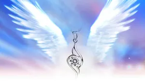 Macro shot of silver angel wing pendant with a brilliant cut white zircon center stone