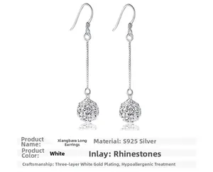 Detail of S925 sterling silver Shamballa earrings with tassels and sparkling rhinestones