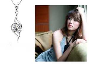 Detail of s925 silver necklace featuring a sparkling angel wing pendant with zircon stone