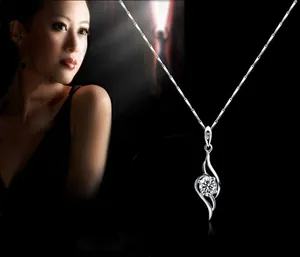 Close-up of S925 silver necklace with a twisted angel wing pendant and sparkling zircon stone