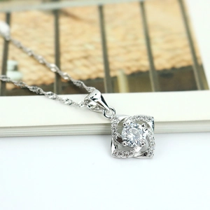 Elegant S925 silver clover necklace featuring a sparkling diamond pendant on a twisted chain