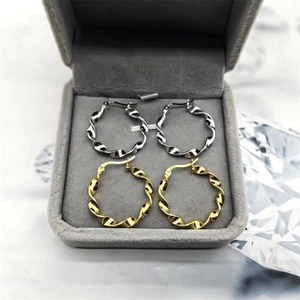 Elegant s925 sterling silver twisted hoop earrings in gold and silver finish