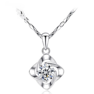 Elegant S925 sterling silver necklace with swirling flower pendant and pavé zirconia