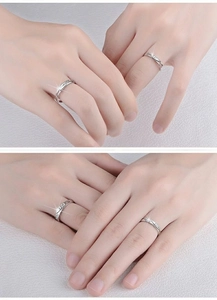 Macro shot of silver couples rings with 520 and 1314 engravings and cubic zirconia