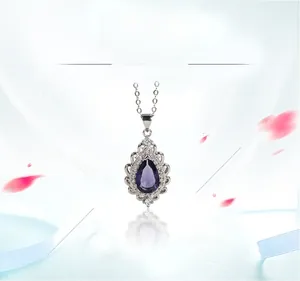 Detailed macro view of pear-cut amethyst pendant with white zircon halo on S925 silver chain