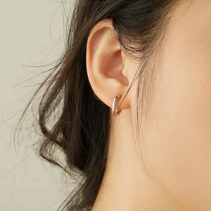 Minimalist S925 sterling silver hoop earrings shown on a model for daily commute style