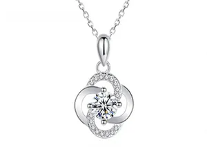 Macro view of S925 sterling silver four-leaf clover pendant with sparkling center stone