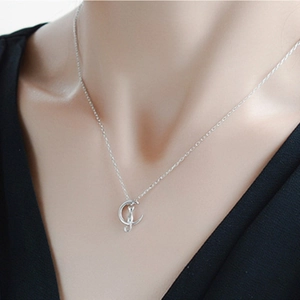 S925 sterling silver necklace featuring a cat sitting on a crescent moon pendant