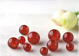 Macro shot of natural red agate beads with a smooth oily luster for S925 silver jewelry