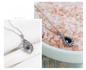 Close-up of S925 silver necklace with pear-cut purple amethyst and crystal halo detail