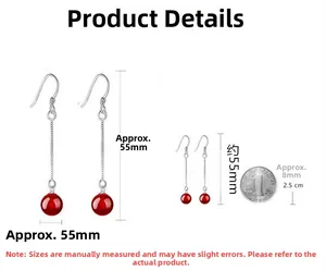Detail of S925 silver long drop earrings with red agate beads and size reference coin