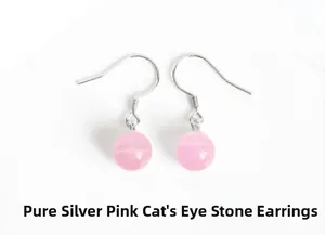 Macro view of sterling silver earhooks featuring a round pink cat-eye stone drop charm