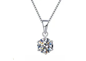 Detailed close-up of a silver-tone six-prong pendant necklace with a brilliant round stone