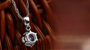 Macro shot of S925 sterling silver six-prong crown pendant with sparkling round-cut stone