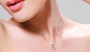 Close-up of S925 sterling silver six-claw pendant necklace worn on a woman neck