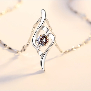 Macro shot of s925 sterling silver heart pendant with sparkling round moissanite center