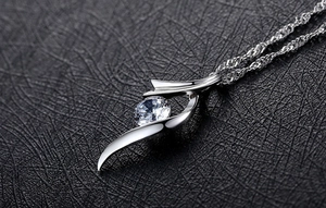 Macro shot of S925 sterling silver flower pendant necklace with brilliant round zircon