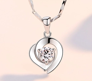 Close-up of S925 sterling silver heart necklace with a sparkling round zircon stone