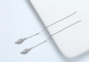 Detailed view of S925 sterling silver leaf threader earrings with delicate long chains