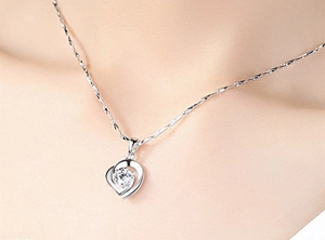 Close-up of S925 silver double heart necklace with a sparkling cubic zirconia pendant