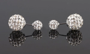 Macro detail of S925 sterling silver double-sided stud earrings with shimmering white crystals