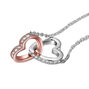 Interlocking double heart necklace with rose gold and silver finish on white background