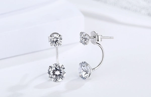 Macro view of S925 sterling silver double-headed earrings with sparkling zircon stones