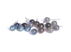Macro detail of S925 sterling silver studs with round labradorite displaying blue fire