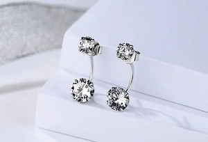 Detailed macro view of S925 sterling silver ear jackets with sparkling round cubic zirconia