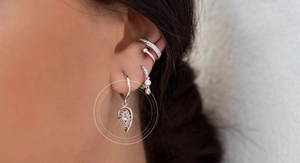 Detail view of S925 sterling silver teardrop earrings with bohemian eye motif and diamond
