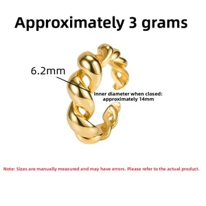 Detailed view of twisted gold ring showing 6.2mm width and 14mm inner diameter size