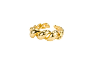 Close-up of golden croissant style twisted ring showing polished metal texture and detail