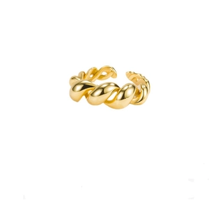 Macro detail of 925 sterling silver twisted croissant ring with glossy gold-plated finish