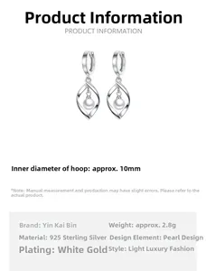 Detailed view of S925 silver twist drop earrings with pearl and 10mm inner diameter