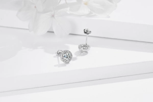 Macro detail of S925 sterling silver halo stud earrings with round brilliant cubic zirconia