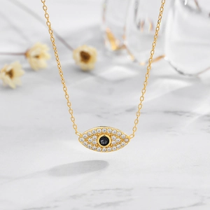Gold Evil Eye necklace in S925 sterling silver with white zircon pavé and black stone center