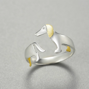 Minimalist silver dachshund ring with gold plated ears in a sleek two-tone style