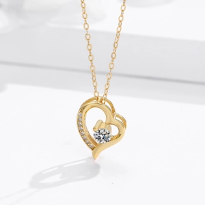 Elegant gold heart pendant necklace with large round center stone and pave accents