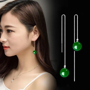 Long S925 sterling silver tassel earrings with green agate beads on Asian model and black background