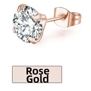 Macro detail of rose gold stud earring with round cut zircon in four-prong setting