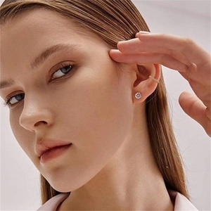 Elegant rose gold S925 silver stud earrings with zircon and textured ear cuff set on model