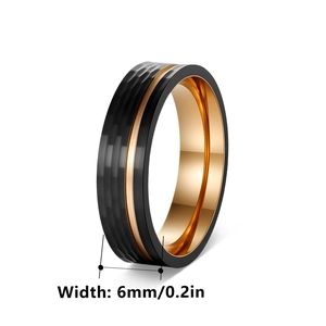 6mm hammered black stainless steel ring with a rose gold center groove and inner band