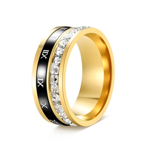 Detail view of gold rotating ring with Roman numerals and square-cut cubic zirconia