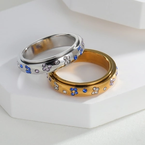 Spinning butterfly star stress relief ring in silver and gold with colorful rhinestones