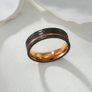 Close-up of hammered 304 stainless steel ring with rose gold groove and mirror finish